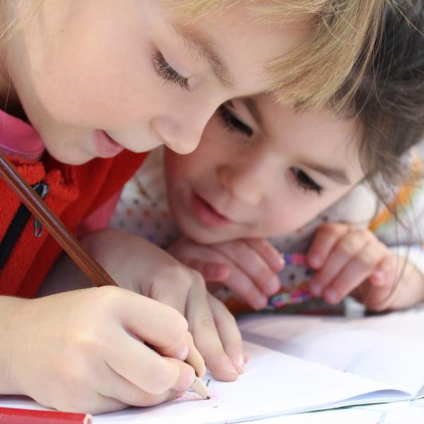 Two little girls drawing